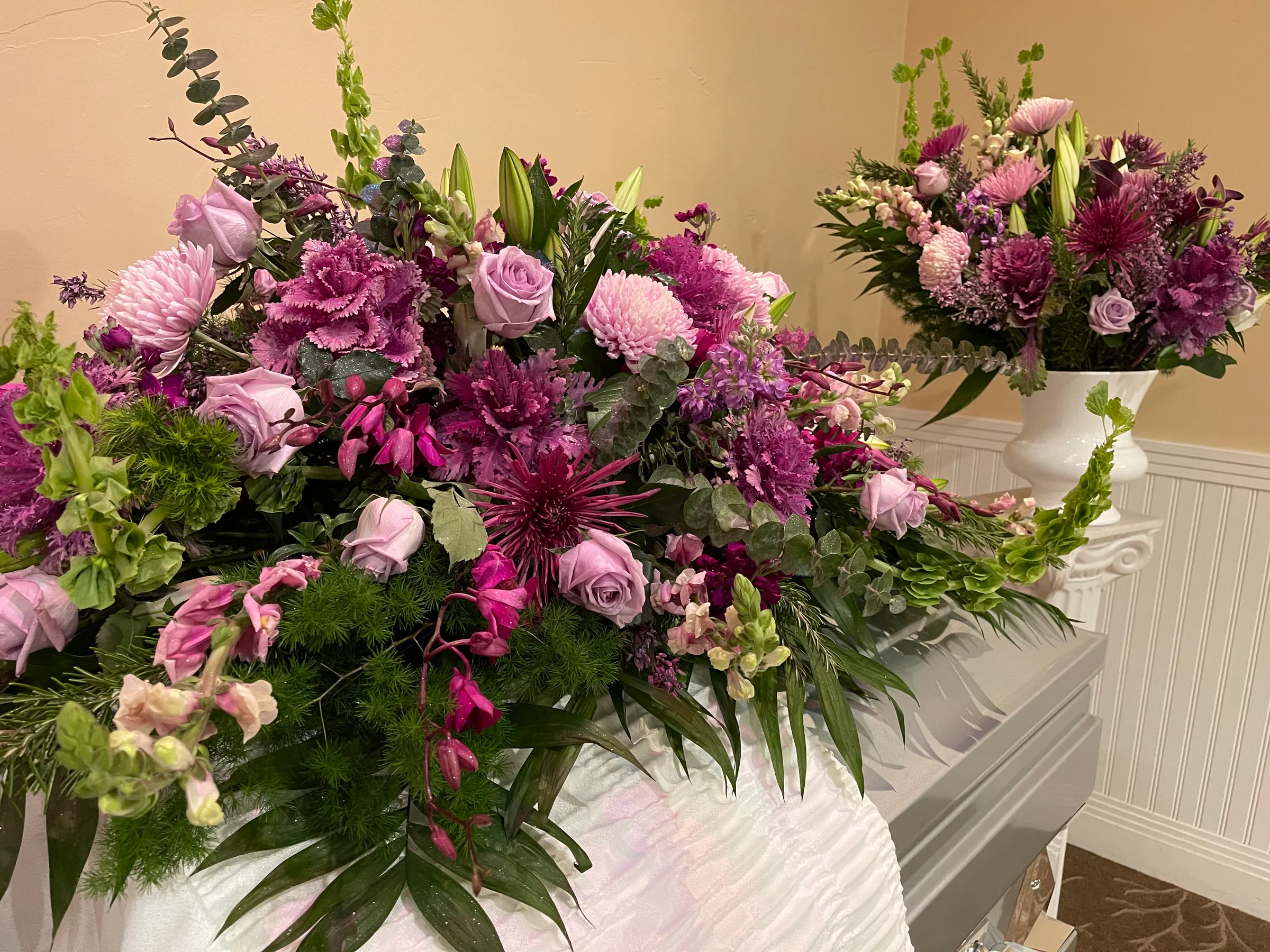 Purple and pink floral arrangements indoors